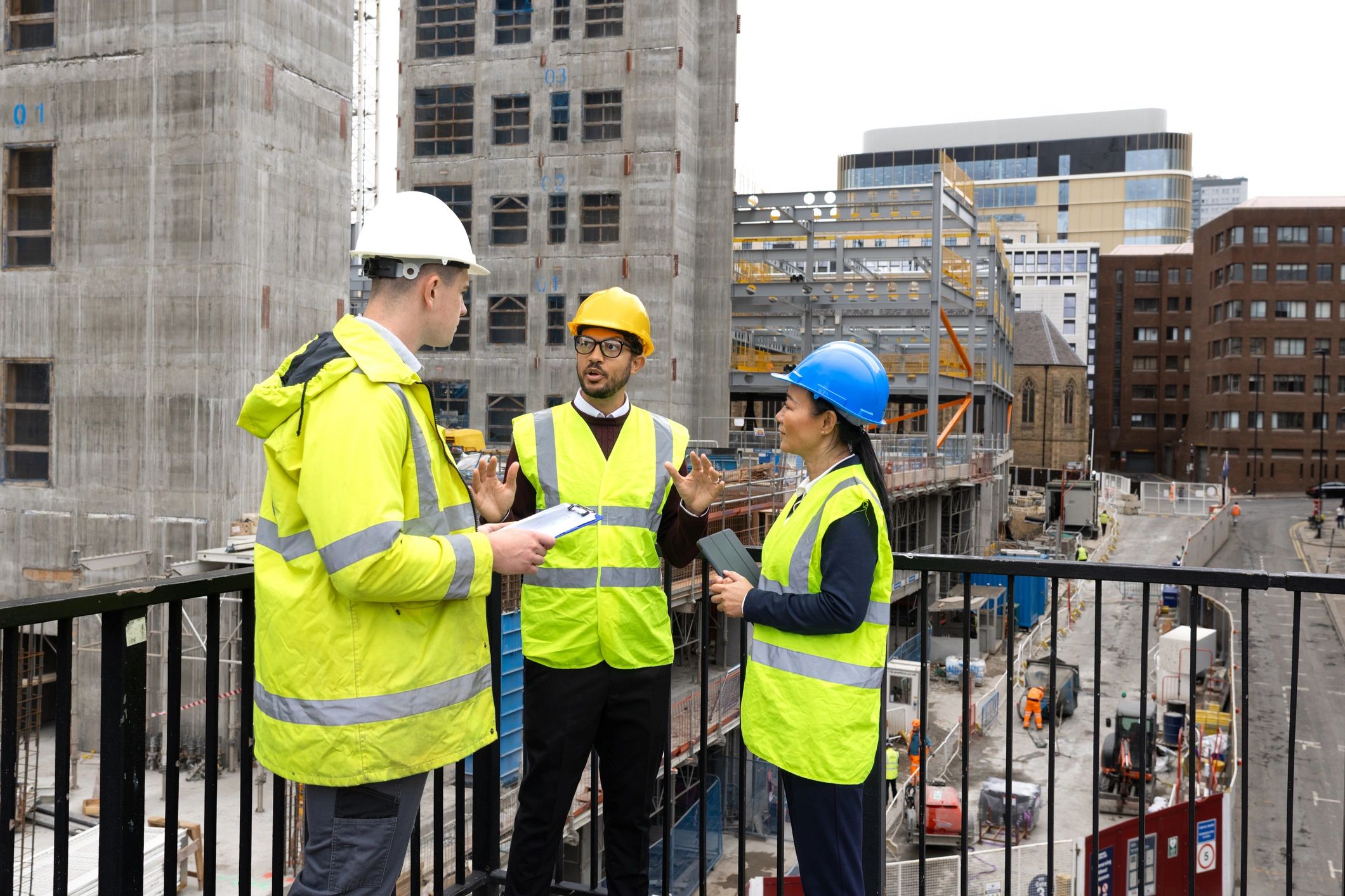 Construction leadership team reviewing plans on site